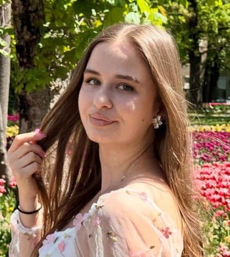 Georgiana Ion among tulips in a park